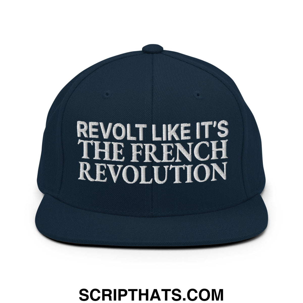 Navy blue snapback hat with white embroidered revolt like it’s the french revolution text and flat bill brim