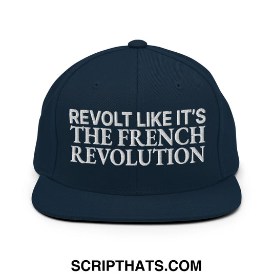 Navy blue snapback hat with white embroidered revolt like it’s the french revolution text and flat bill brim