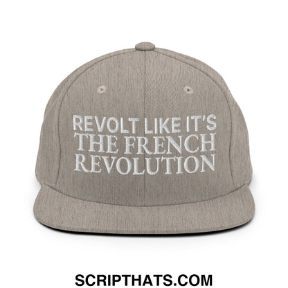 Gray snapback hat with white embroidered text reading revolt like it is the french revolution on flat bill brim