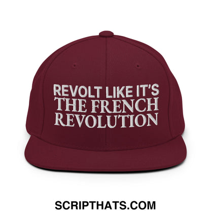 Maroon flat bill snapback hat with white embroidered text revolt like it’s the french revolution