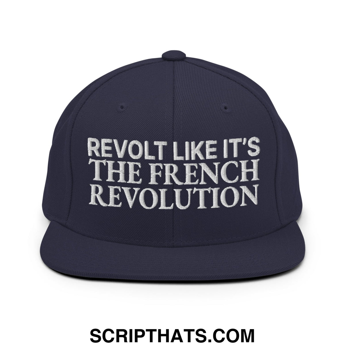 Navy blue snapback hat with white embroidered text reading revolt like it’s the french revolution on flat bill brim