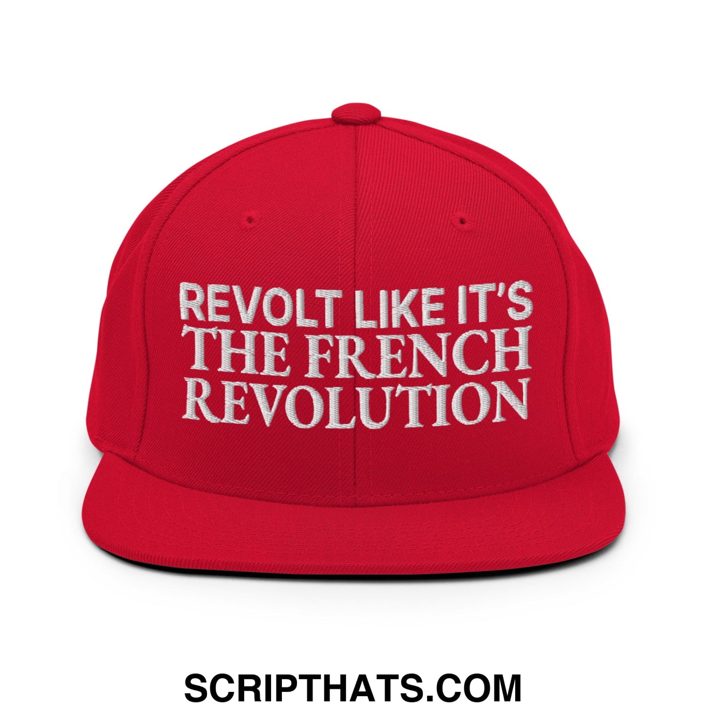 Red snapback hat with flat bill brim featuring white embroidered text revolt like it’s the french revolution