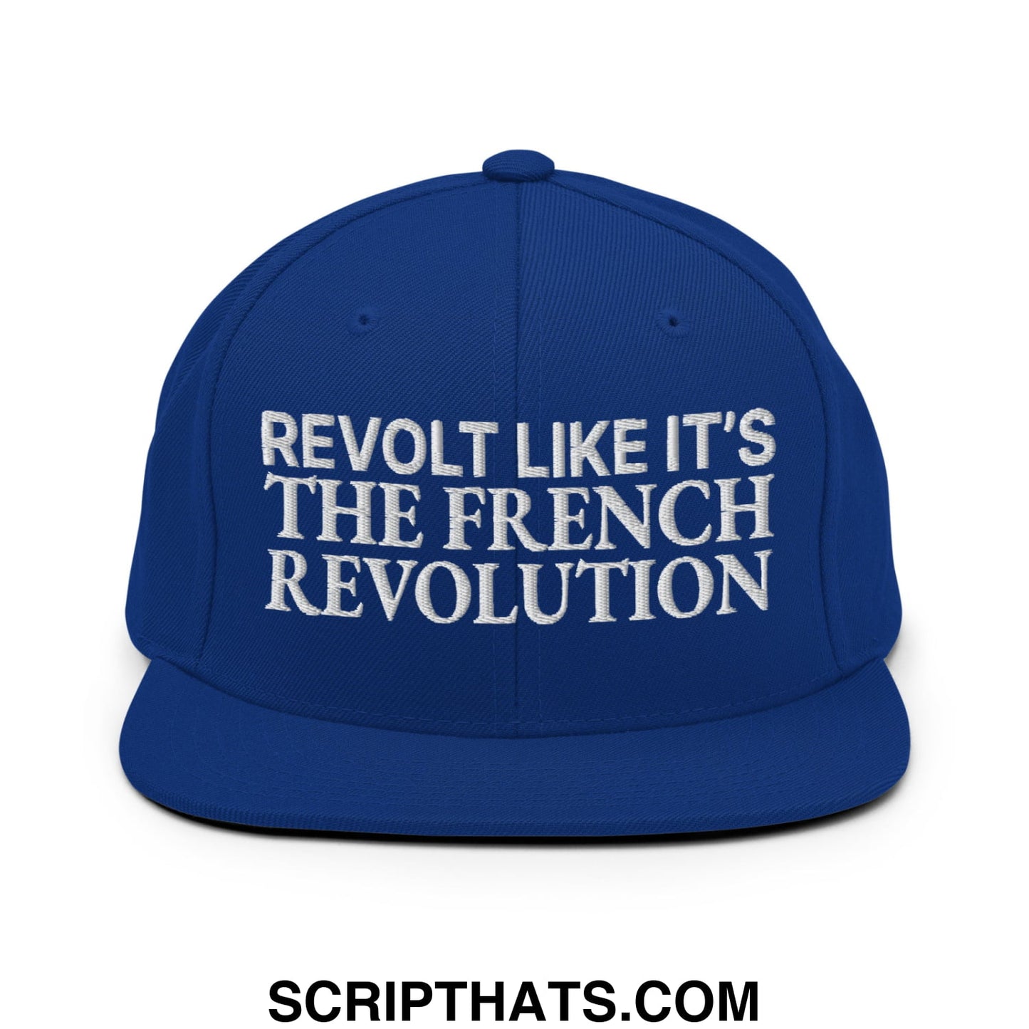 Royal blue snapback cap with white embroidered revolt like it’s the french revolution text and flat bill brim
