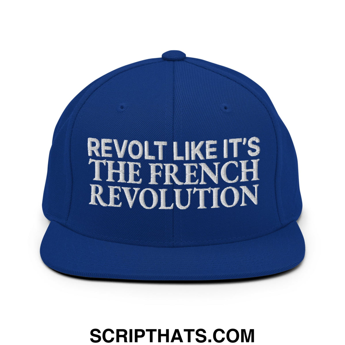 Royal blue snapback cap with white embroidered revolt like it’s the french revolution text and flat bill brim
