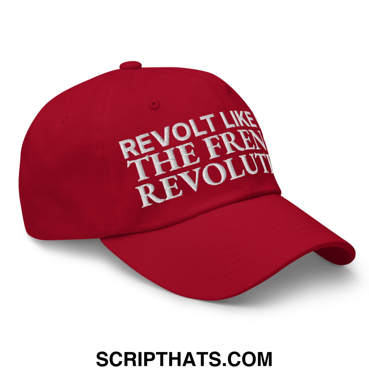 Red unstructured dad hat with white embroidered revolt like the french revolution text for casual wear