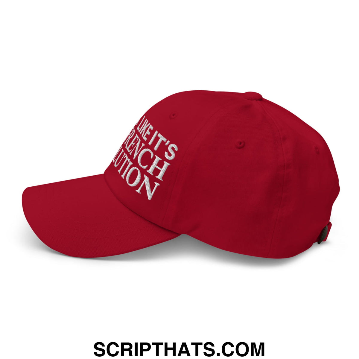 Red unstructured dad hat featuring white embroidered text like it is french revolution for casual wear