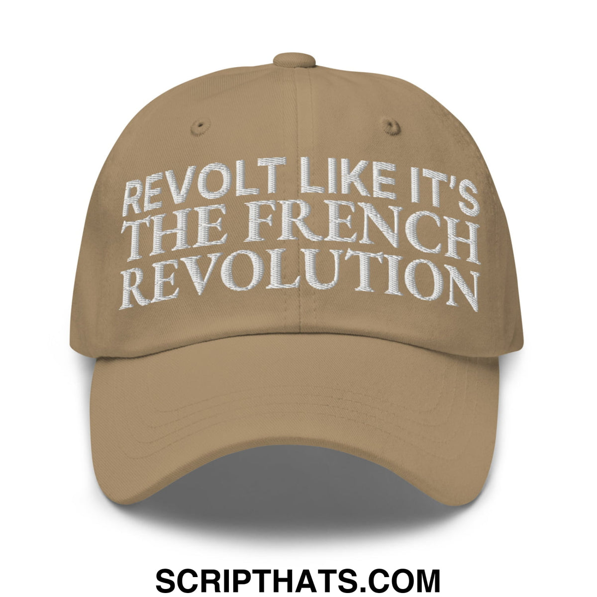 Tan unstructured dad hat with white embroidered text reading revolt like it’s the french revolution