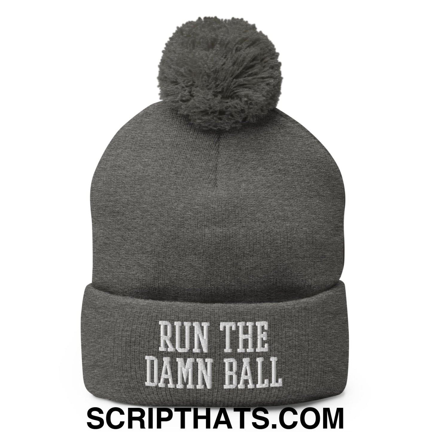 Gray knit beanie with matching fuzzy pom pom and white embroidered run the damn ball text on the cuff