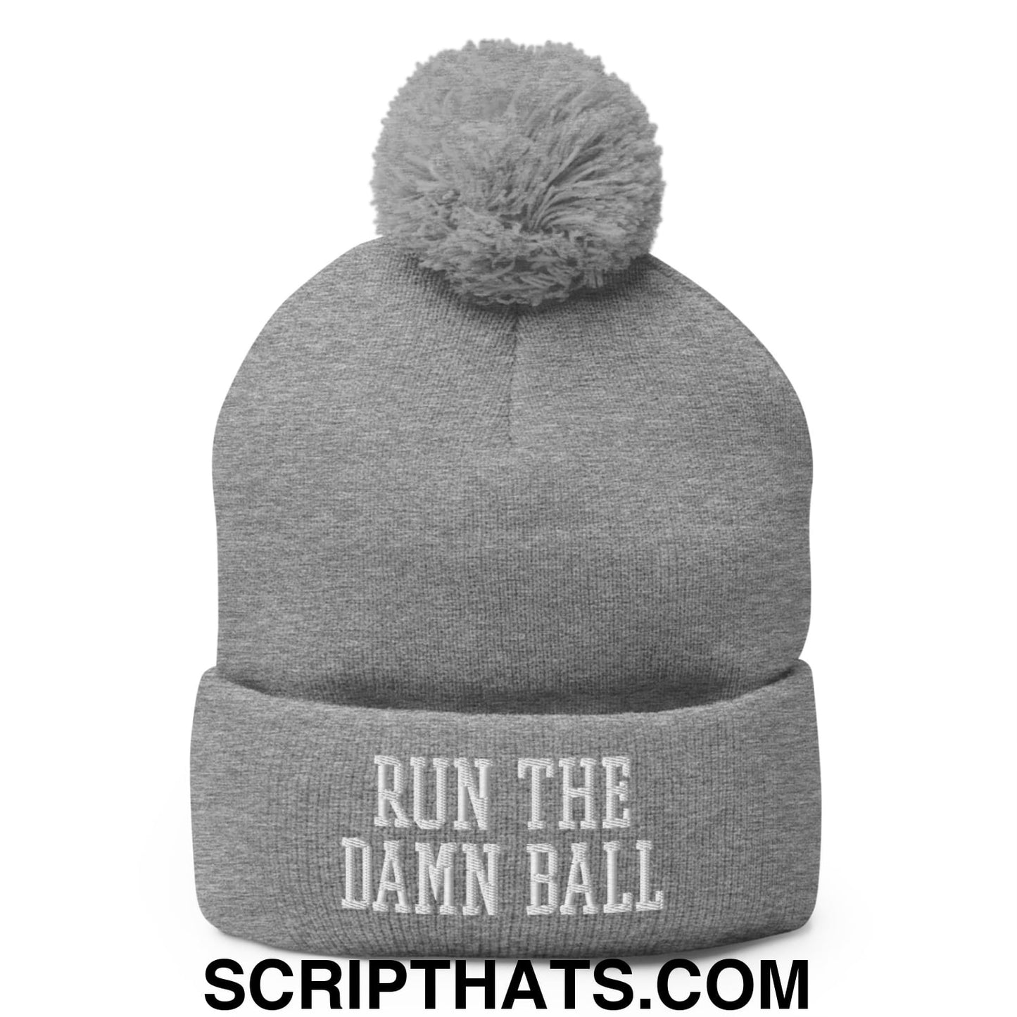 Gray knit pom pom beanie with white embroidered run the damn ball text on the cuff in soft knit material