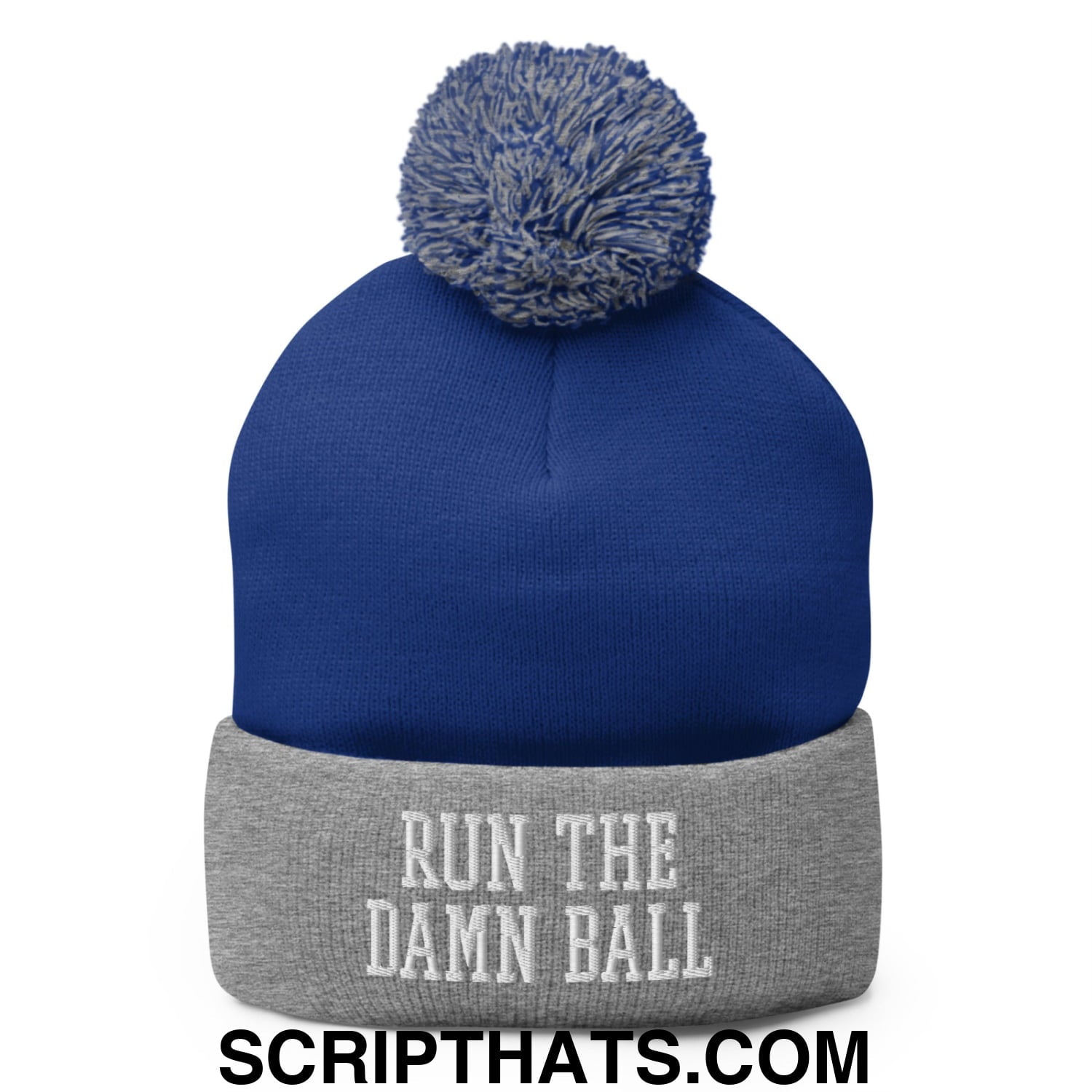Royal blue knit beanie with gray cuffed brim and pom pom featuring white embroidered text run the damn ball