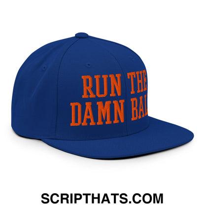Royal blue snapback hat with bold orange embroidered run the damn ball text and a flat bill brim design