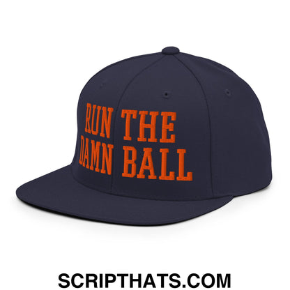 Navy blue snapback hat with bold orange embroidered text run the damn ball on flat bill brim