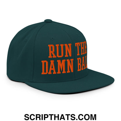 Dark green snapback cap with bold orange embroidered text run the damn ball on a flat bill brim design