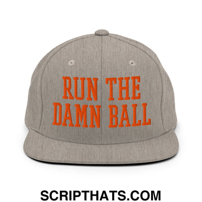 Gray snapback cap with bold orange embroidered text run the damn ball on a flat bill brim front