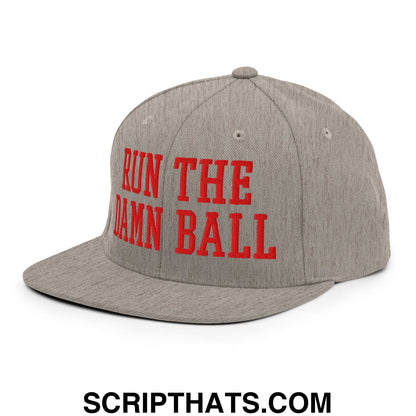 Gray snapback cap with bold red embroidered run the damn ball text on flat bill brim for casual wear