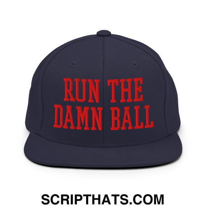 Navy blue snapback hat with bold red embroidered run the damn ball text and flat bill brim design
