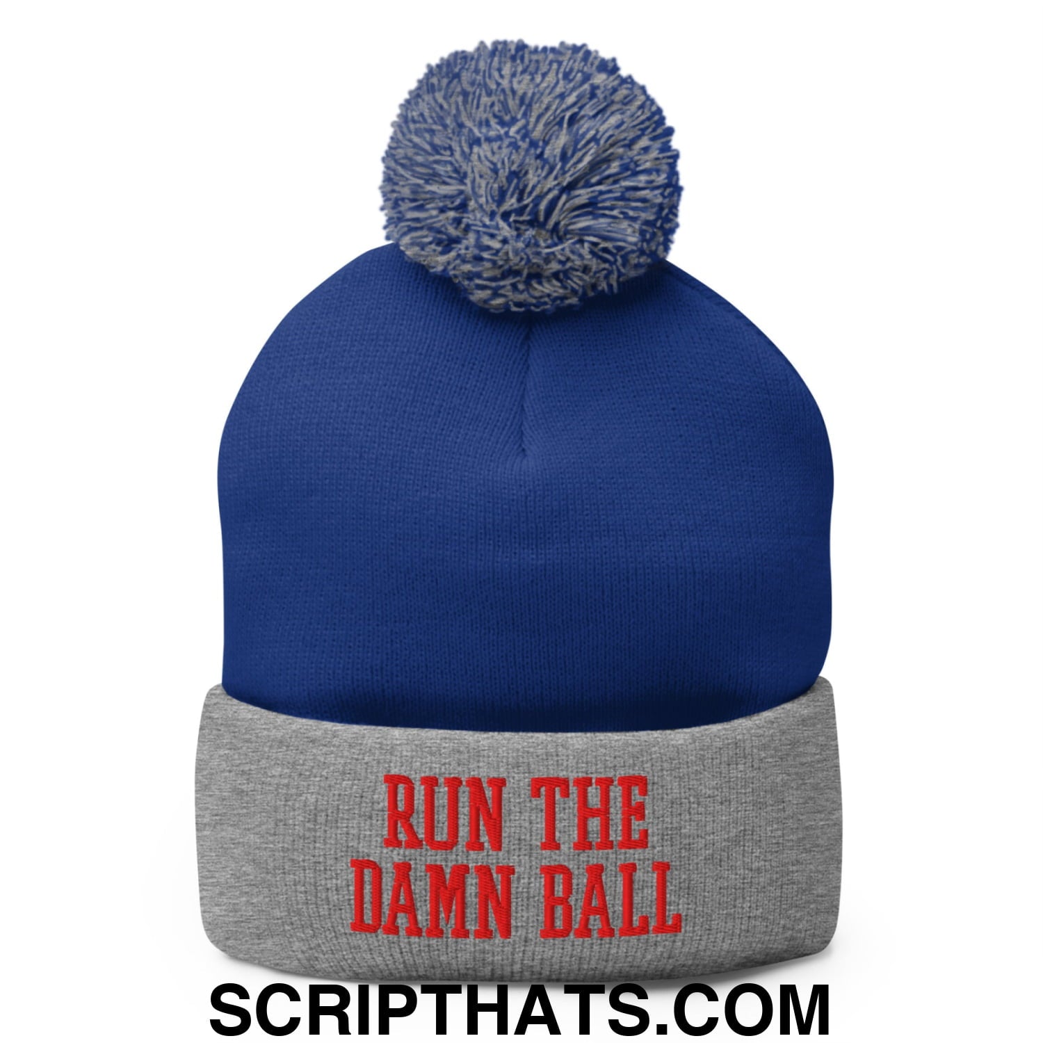 Blue knit beanie with gray pom pom and red run the damn ball embroidered text on the cuff