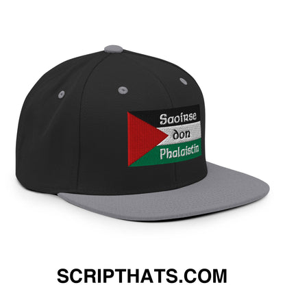Black and gray snapback hat with embroidered palestinian flag patch and white saoirse don phalaistin text on flat bill brim