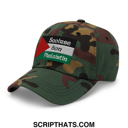 A camouflage unstructured dad hat with an embroidered palestinian flag patch and irish gaelic text titled saoirse don phalaistin