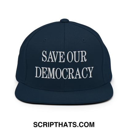Navy blue snapback hat with white embroidered save our democracy text and flat bill brim for casual wear