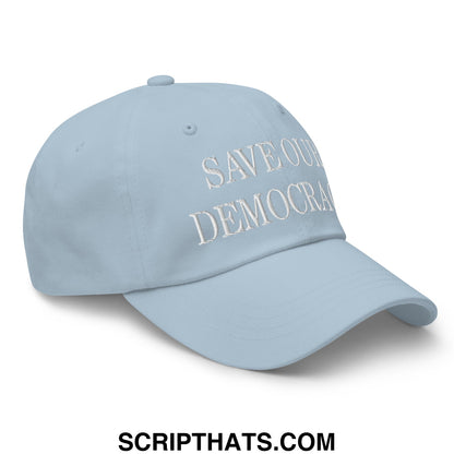 Light blue unstructured dad hat with white embroidered save our democracy text for casual wear