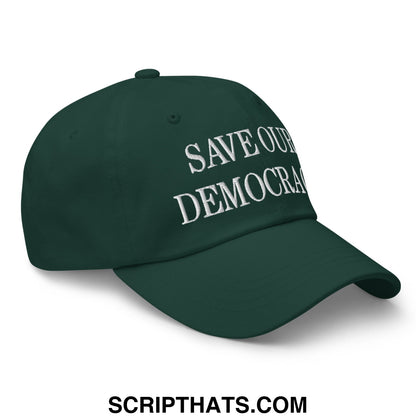 Dark green unstructured dad hat with white embroidered save our democracy text promoting civic engagement