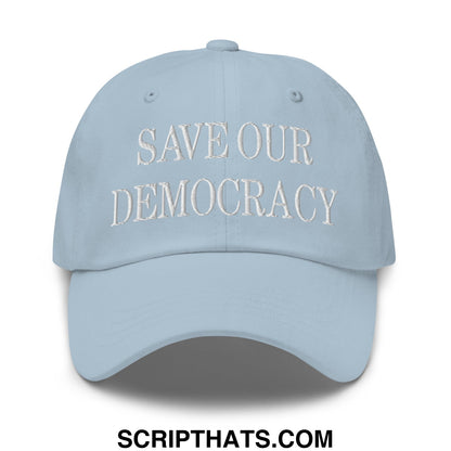 Light blue unstructured dad hat with white embroidered save our democracy text for casual wear