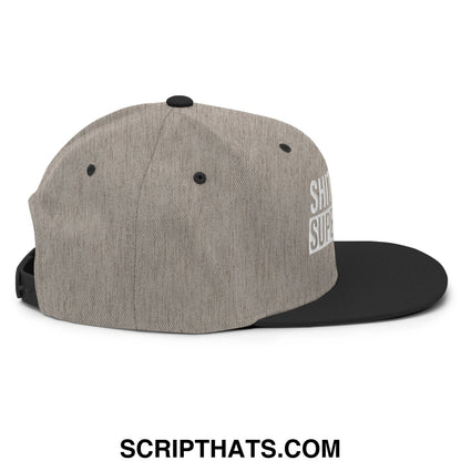 Gray heathered snapback hat with black brim and white embroidered text side detail called shit show supervisor