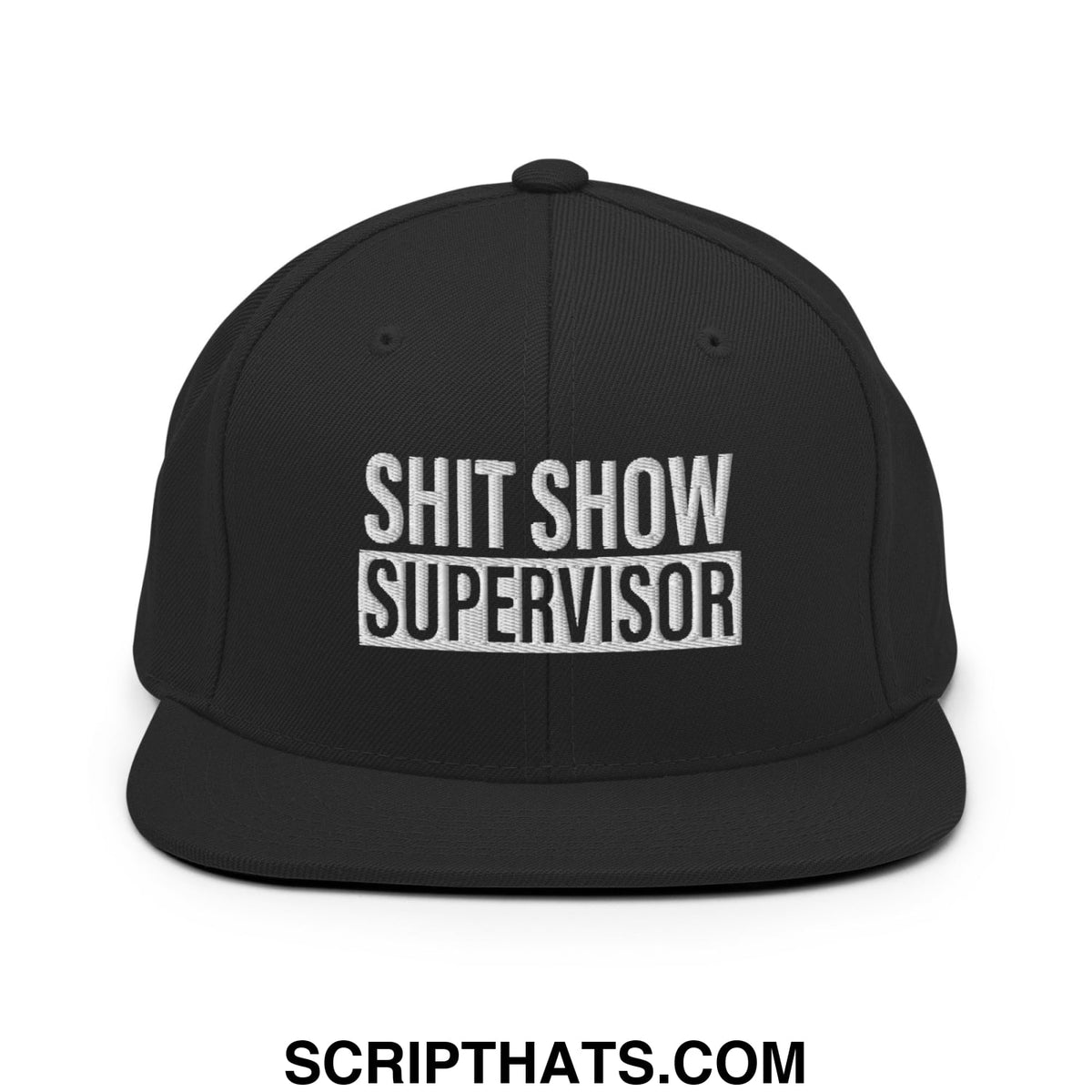 Black snapback cap with white embroidered shit show supervisor text and flat bill brim design