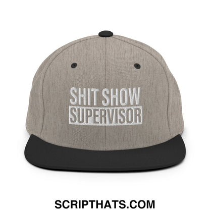 Gray heather snapback hat with black flat bill brim and white embroidered shit show supervisor text on front