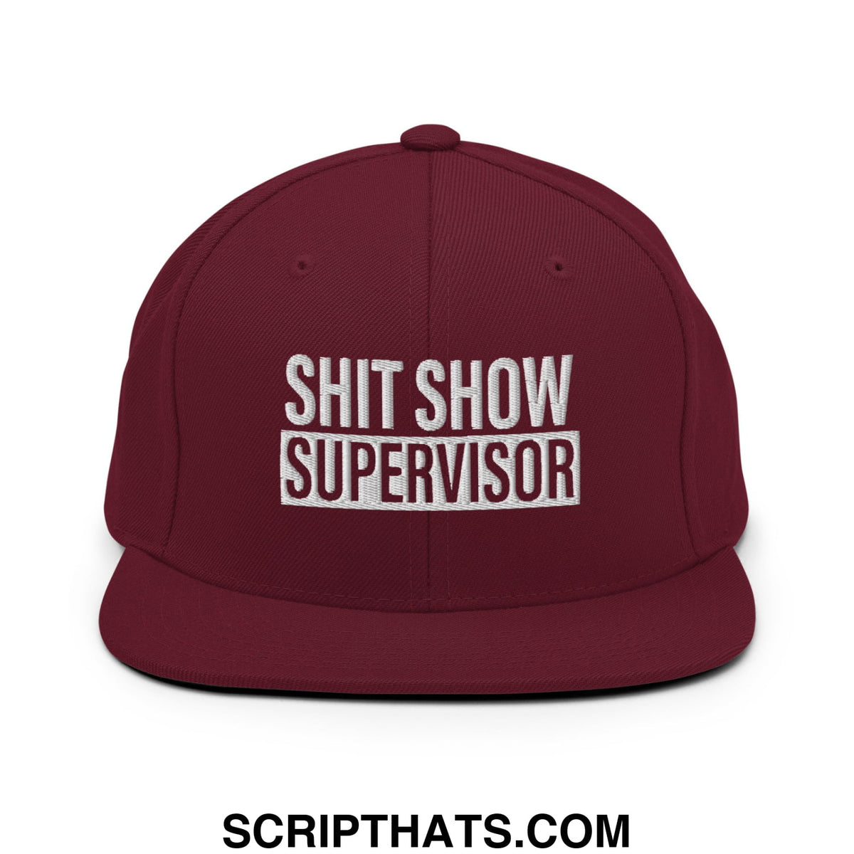 Maroon snapback hat with white embroidered shit show supervisor text and flat bill brim design