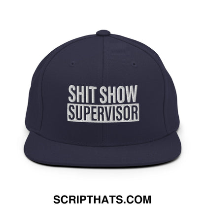 Navy blue snapback hat with white embroidered shit show supervisor text and flat bill brim design
