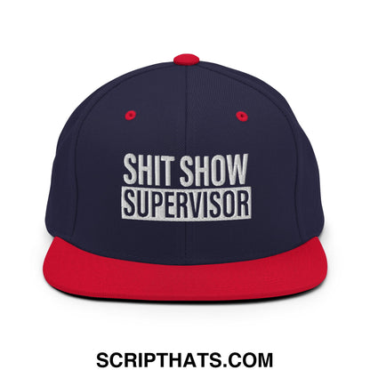 Navy blue and red snapback hat with white embroidered shit show supervisor text and flat bill brim