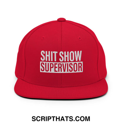 Red snapback cap with a flat bill and white embroidered shit show supervisor text in bold block letters