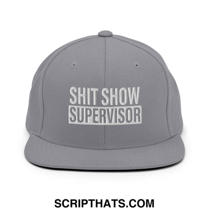 Gray snapback hat with white embroidered shit show supervisor text and flat bill brim in cotton material