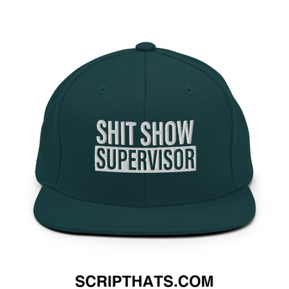 Dark green snapback cap with white embroidered shit show supervisor text and flat bill brim design