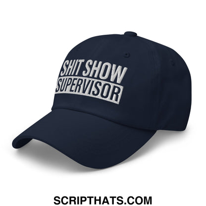 Navy blue unstructured dad hat with shit show supervisor embroidered in white and black thread on front