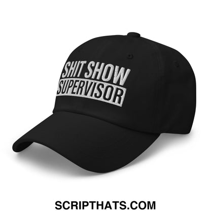 Black embroidered unstructured dad hat with shit show supervisor text in white thread on the front