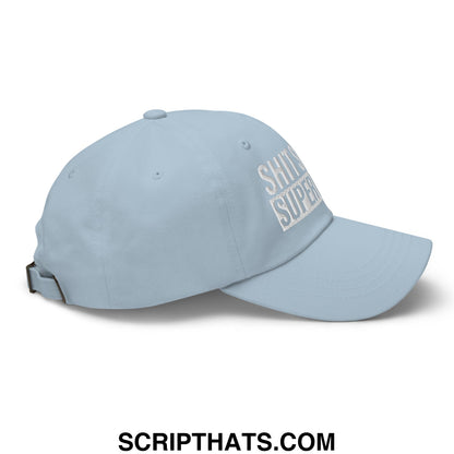 Light blue unstructured dad hat with white embroidered shit’s supreme text front design for casual wear
