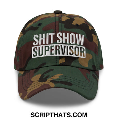 Camouflage unstructured dad hat with shit show supervisor embroidered in white and black lettering on the front