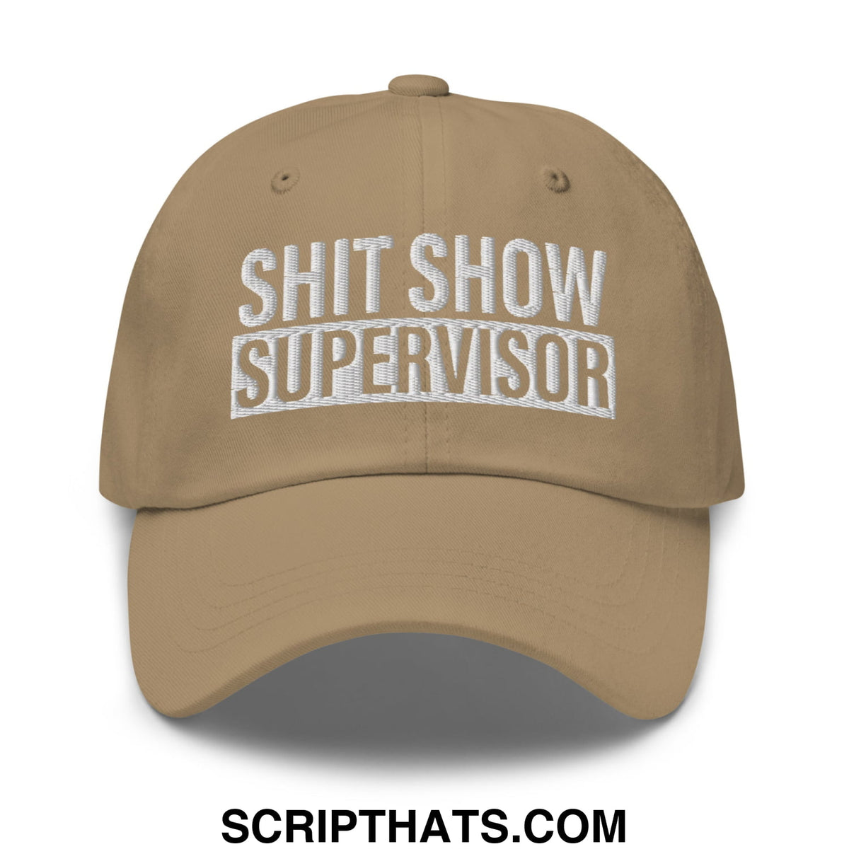 Tan unstructured dad hat with white embroidered shit show supervisor text in bold blocky font