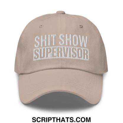 Beige embroidered unstructured dad hat with white shit show supervisor text perfect for casual wear