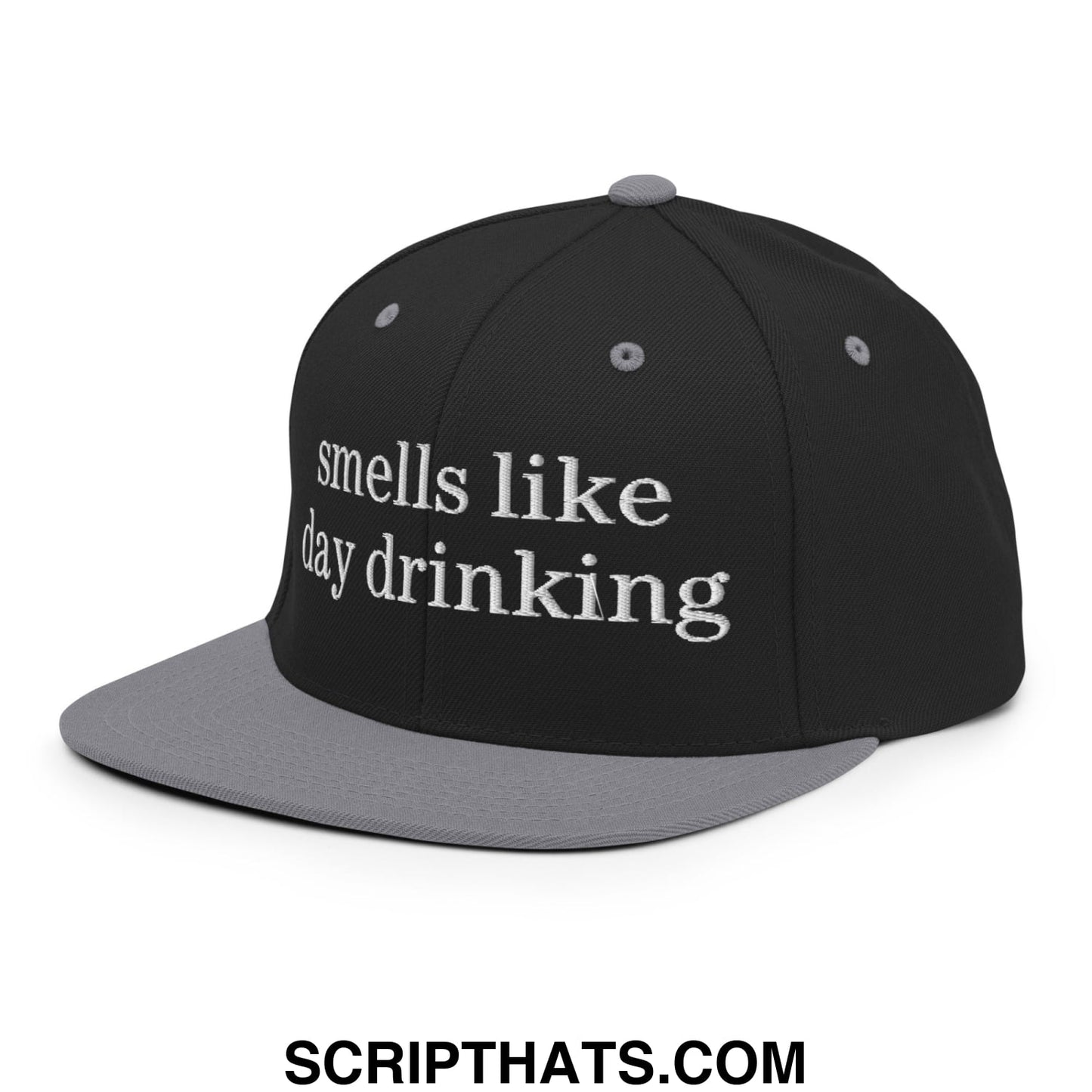 Black and gray snapback cap with white embroidered text reading smells like day drinking flat bill brim design