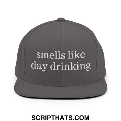 Gray embroidered flat bill snapback hat with white text reading smells like day drinking for casual wear
