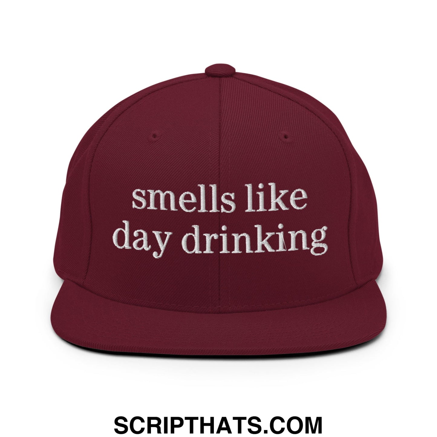 Maroon embroidered flat bill brim snapback hat with white text reads smells like day drinking