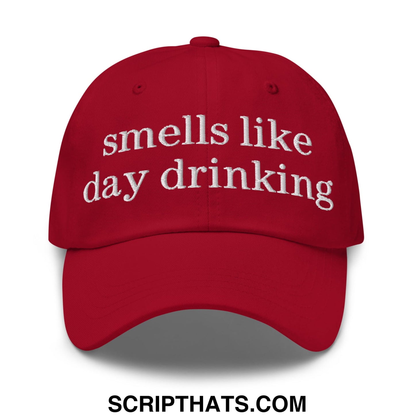 Red embroidered unstructured dad hat with white text smells like day drinking for casual outdoor wear