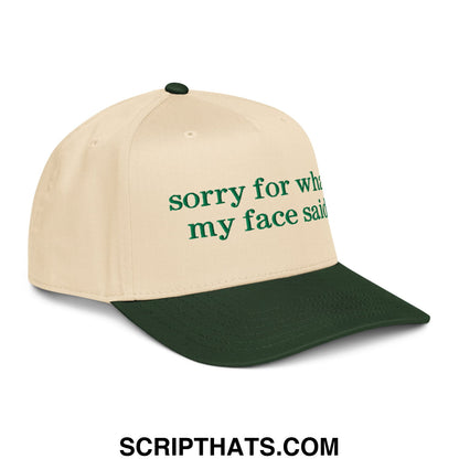 Beige and dark green two-tone baseball snapback hat with embroidered green text reading sorry for what my face said