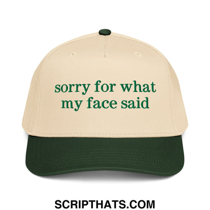 Beige and dark green baseball snapback hat with embroidered sorry for what my face said text in matching green font