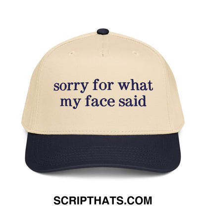 Beige and navy blue embroidered baseball snapback hat with sorry for what my face said text on front panel