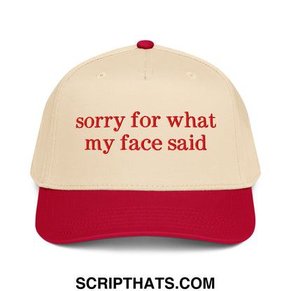 Beige and red baseball snapback hat with embroidered sorry for what my face said text in matching red thread